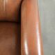 Armchair made of sheepskin leather with refined decorative nail finish
