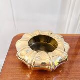Golden brass ashtray with bamboo decoration.