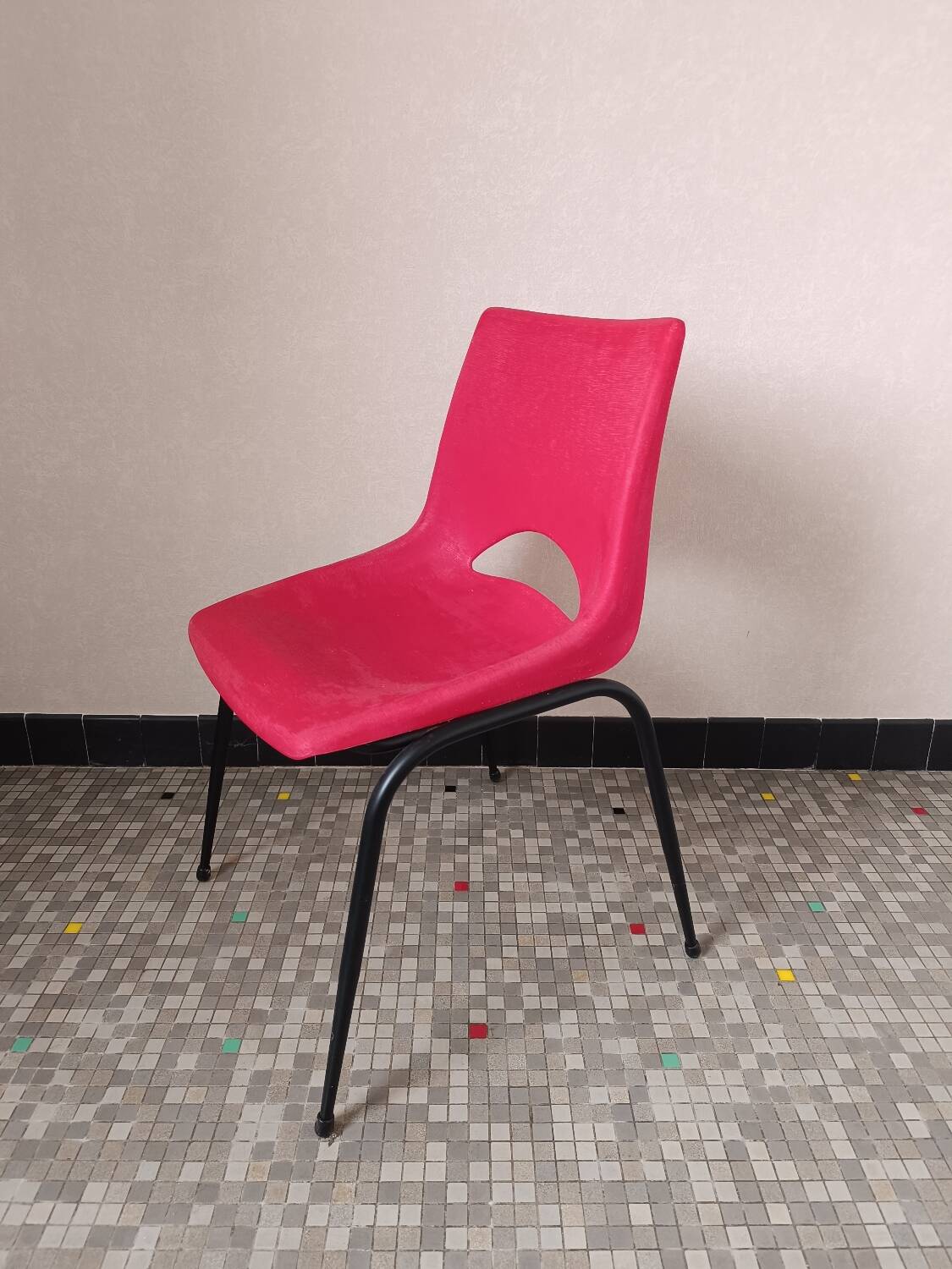 Vintage red plastic shell chair