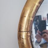 Oval mirror with gold leaf