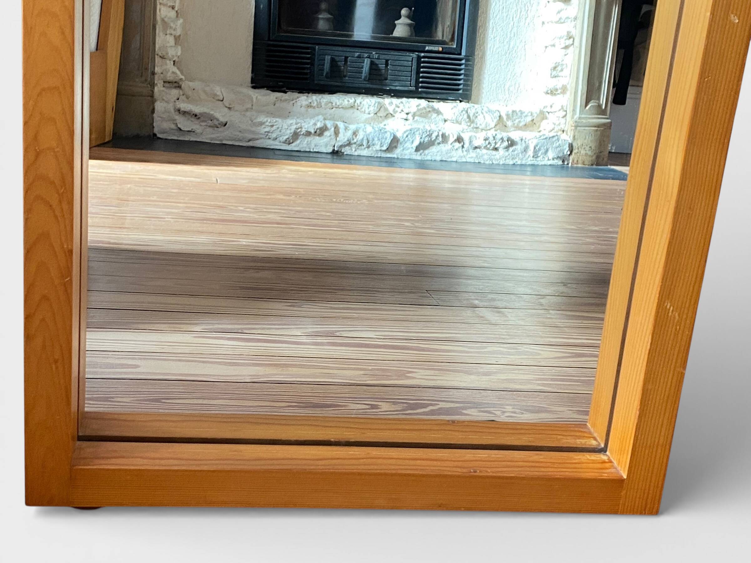 Modernist mirror in solid elm from the 1950s.