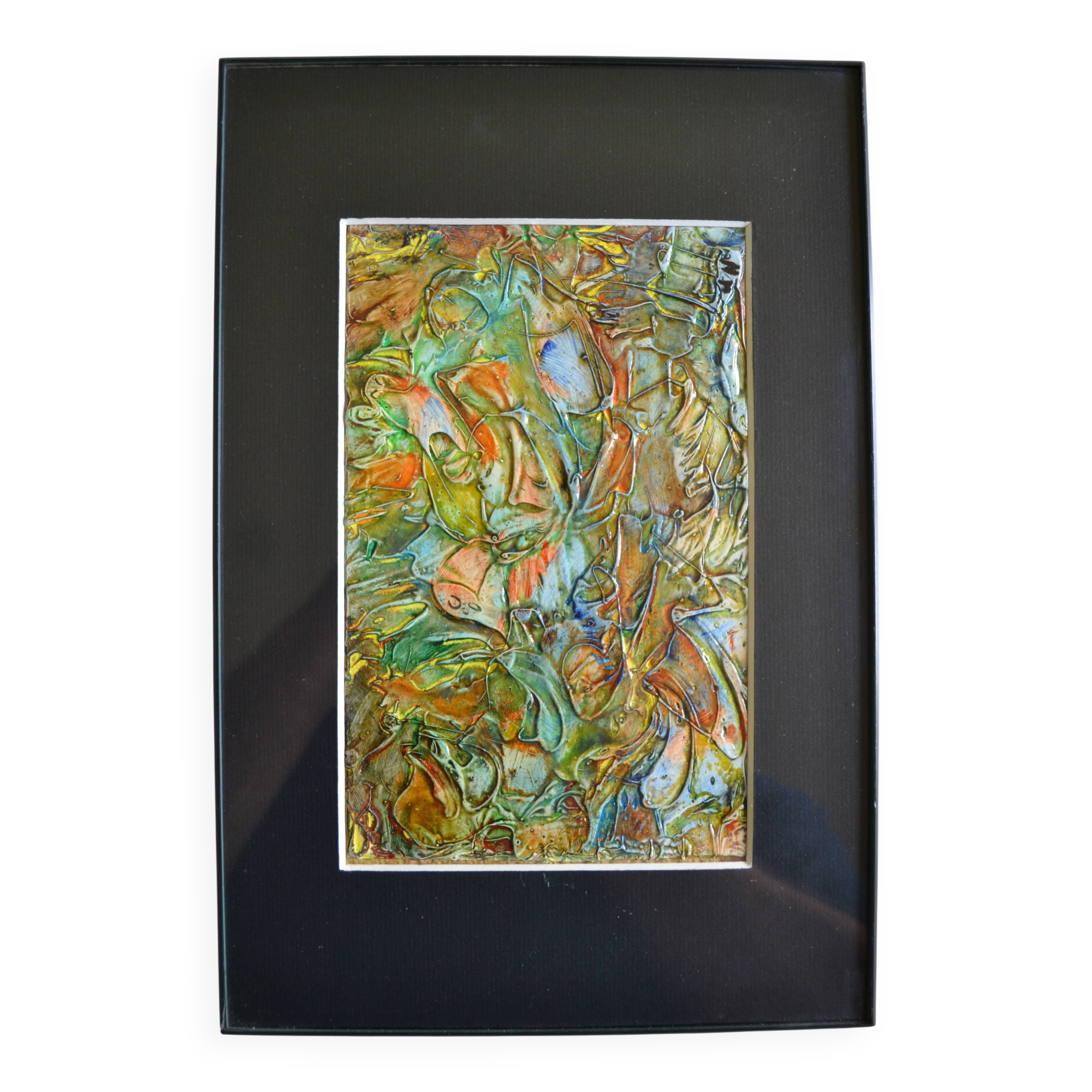 Framed abstract painting under glass