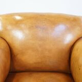 Restored antique Art Deco sheep leather armchair