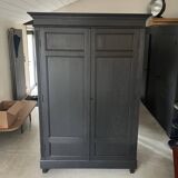 Large black wooden wardrobe