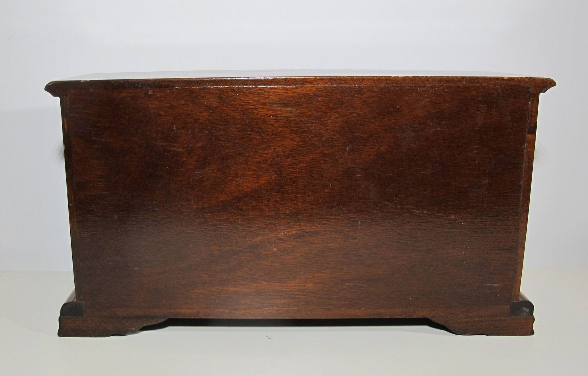 Wooden jewelry box in the shape of a dresser