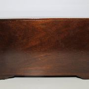 Wooden jewelry box in the shape of a dresser