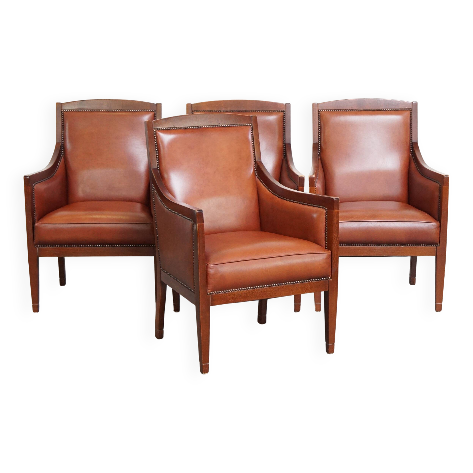 Ensemble majestueux et luxueux de 4 fauteuils design Art Déco en cuir de vachette couleur cognac