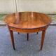 Round extendable dining table Louis XVI in cherry wood from the 1960s.