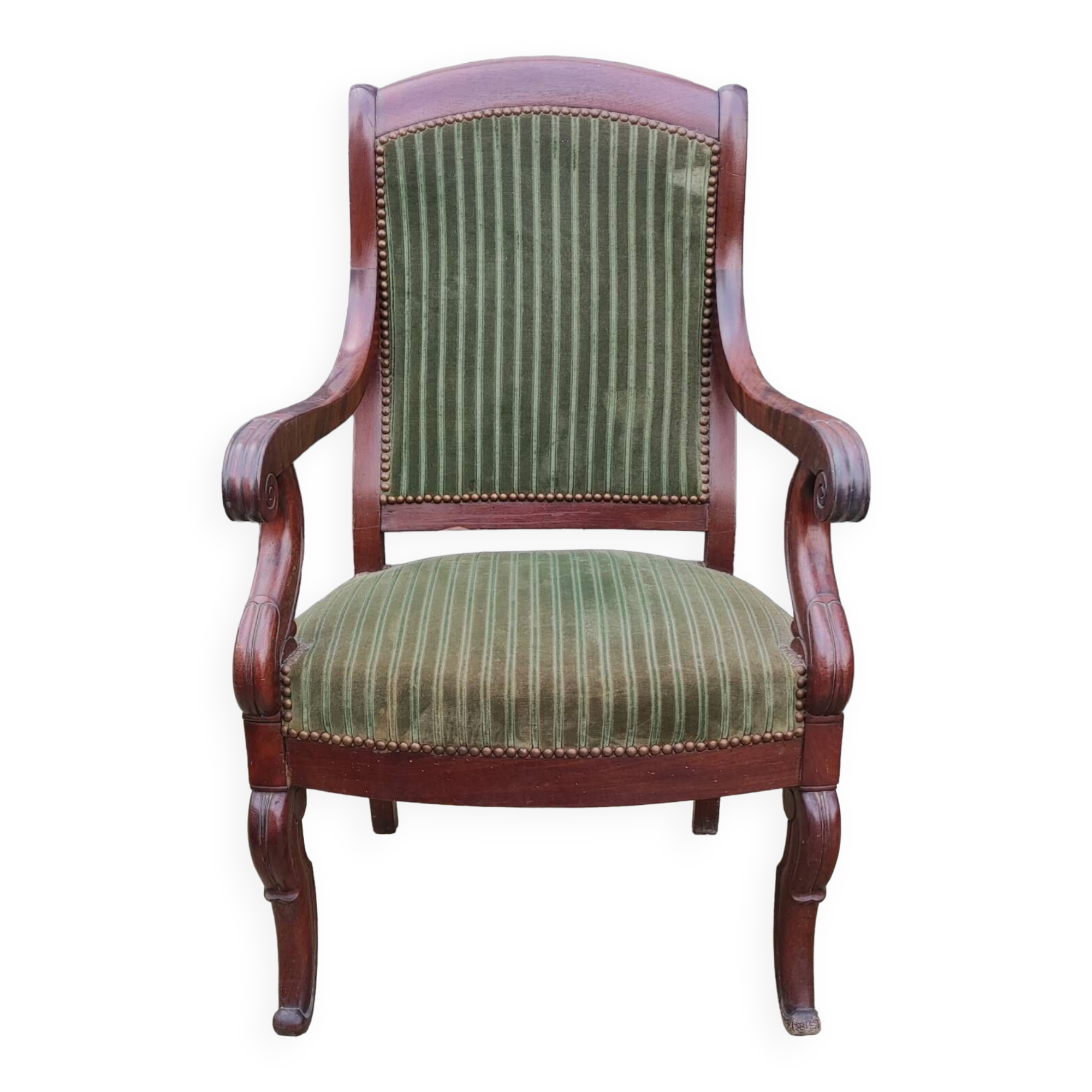Old green velvet armchair