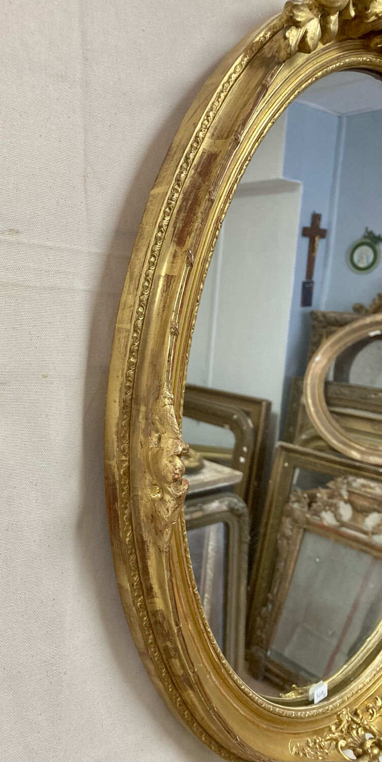 Miroir oval en bois doré 70x49cm
