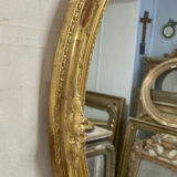 Miroir oval en bois doré 70x49cm