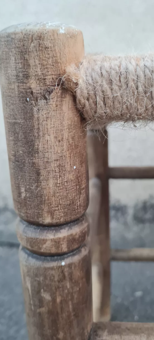 Vintage handmade wooden stool and rope