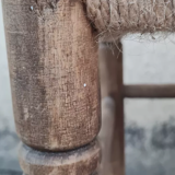 Vintage handmade wooden stool and rope