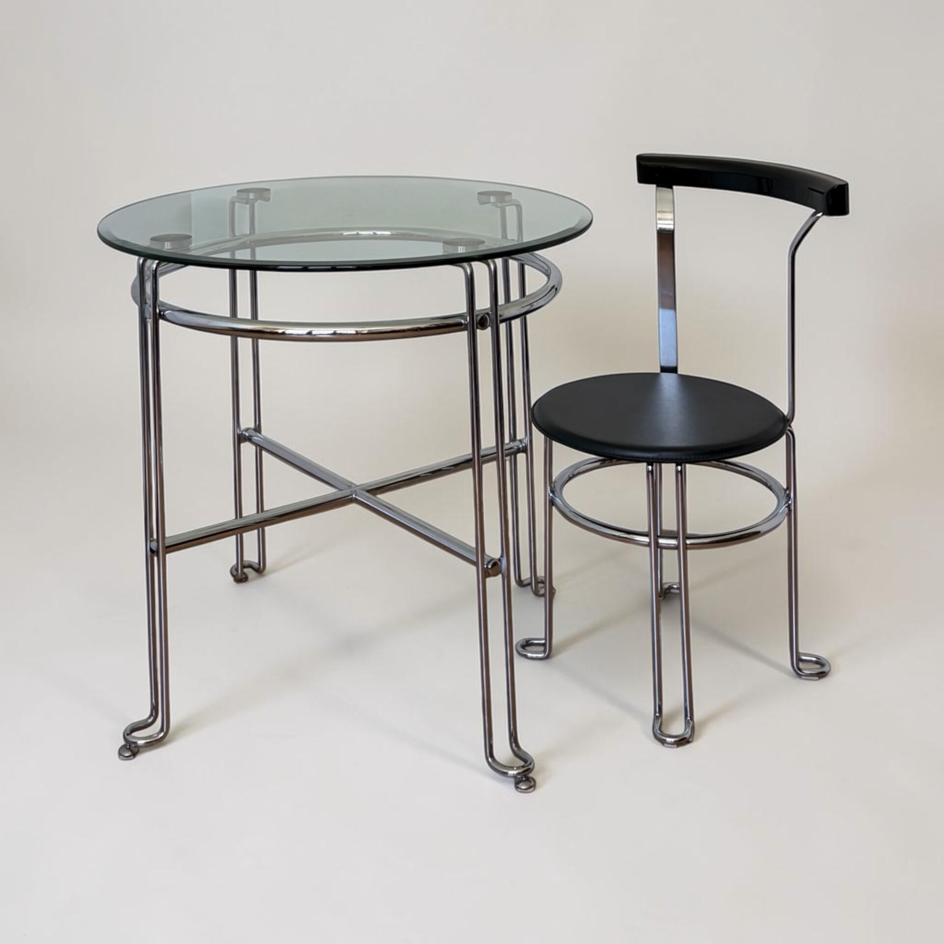 Chrome metal and glass tubular table