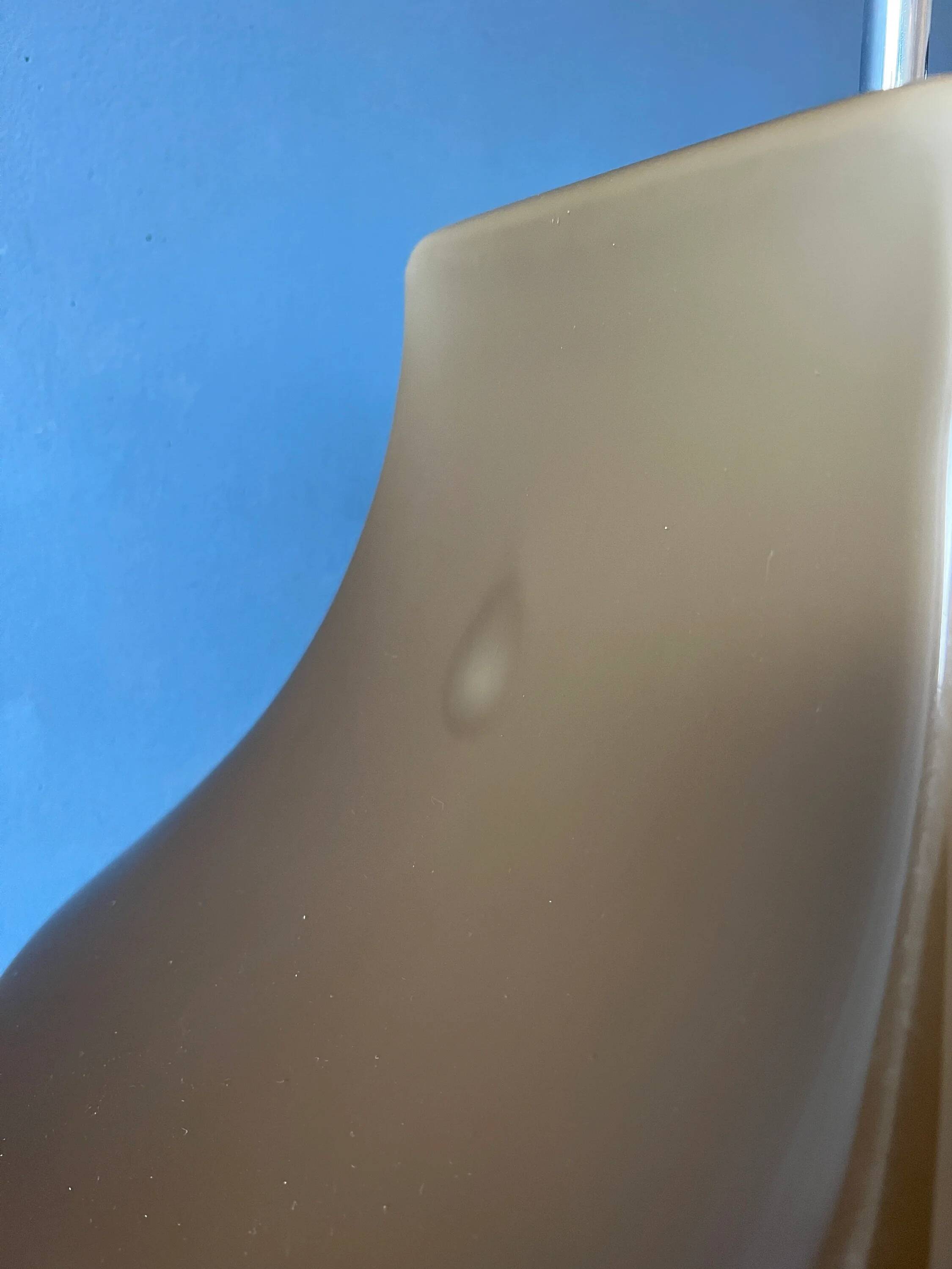 Space Age floor lamp by Willem Hagoort with a beige witch hat-shaped shade.