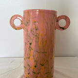 Pink ceramic vase with abstract circular handles
