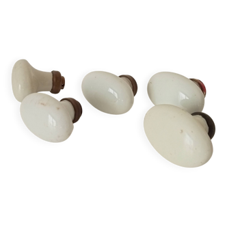 Set of 5 antique door handles in porcelain and brass.