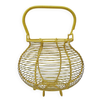 Old yellow painted metal egg basket