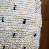 Moroccan Berber white pouf with bohemian polka dots