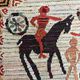 Vintage handwoven tapestry with a folk scene and archaic Slavic writing.