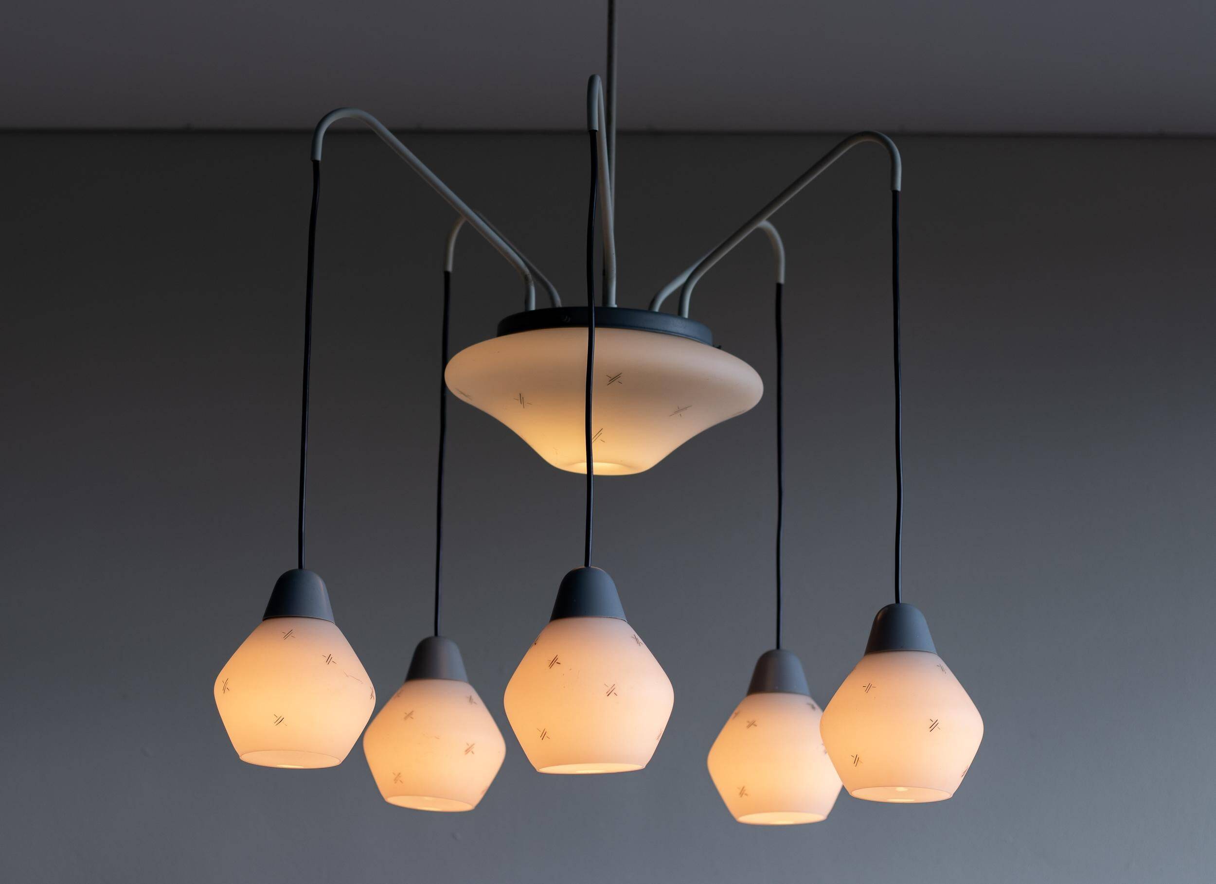 Italian brass enamelled grey chandelier with frosted glass pendants, circa 1960.