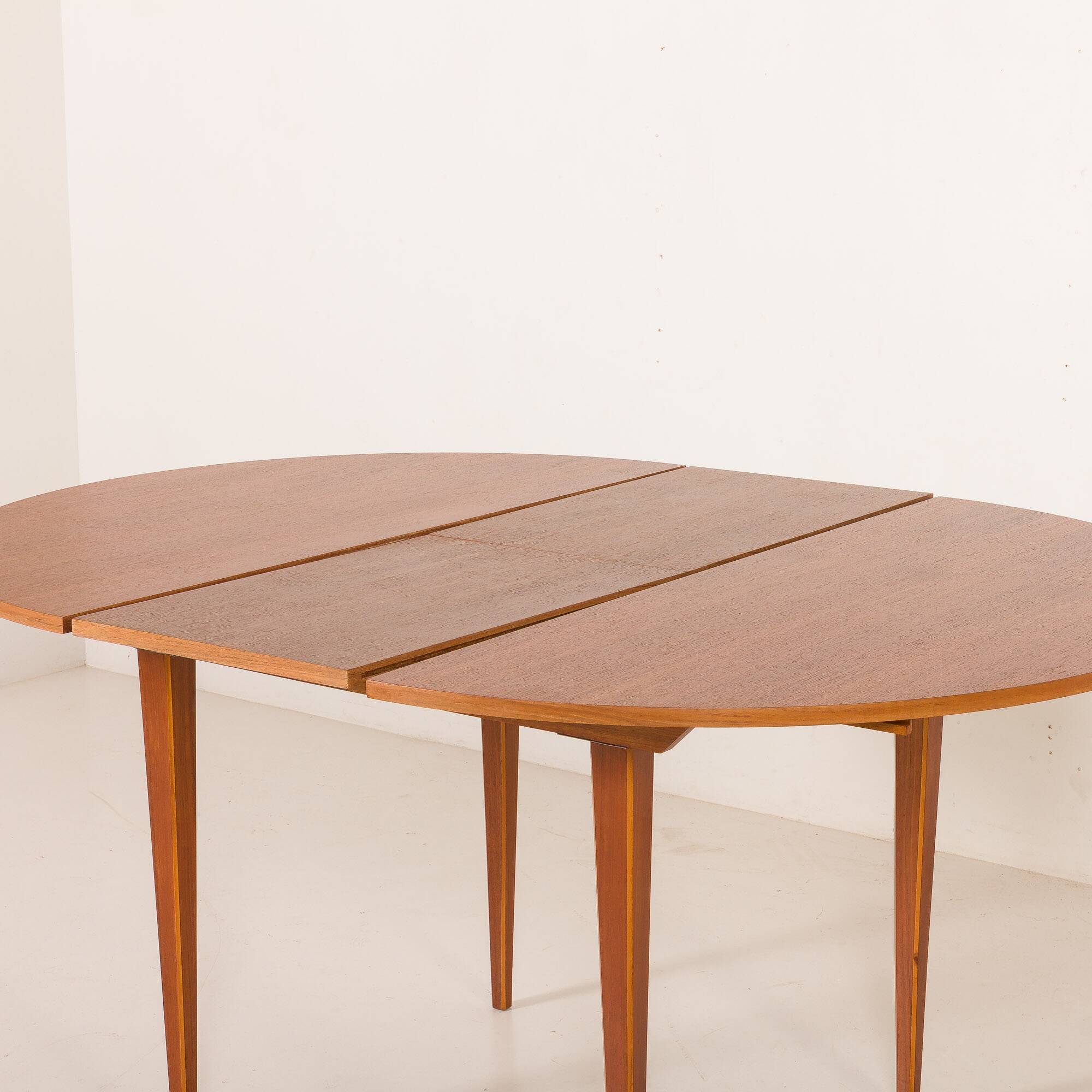 Scandinavian round teak table with hidden extension, 1970s