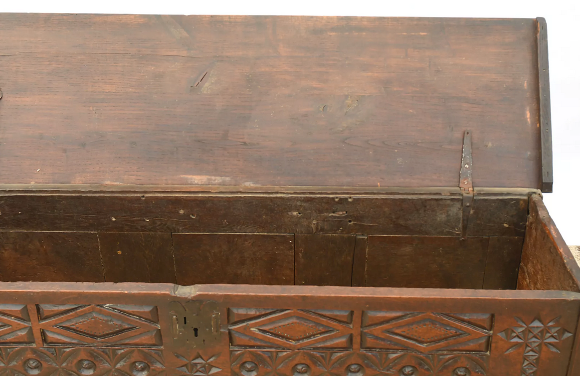 Antique chest in carved wood