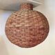 Large vintage lampshade made of hand-woven rattan.