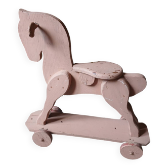 Antique wooden horse on wheels