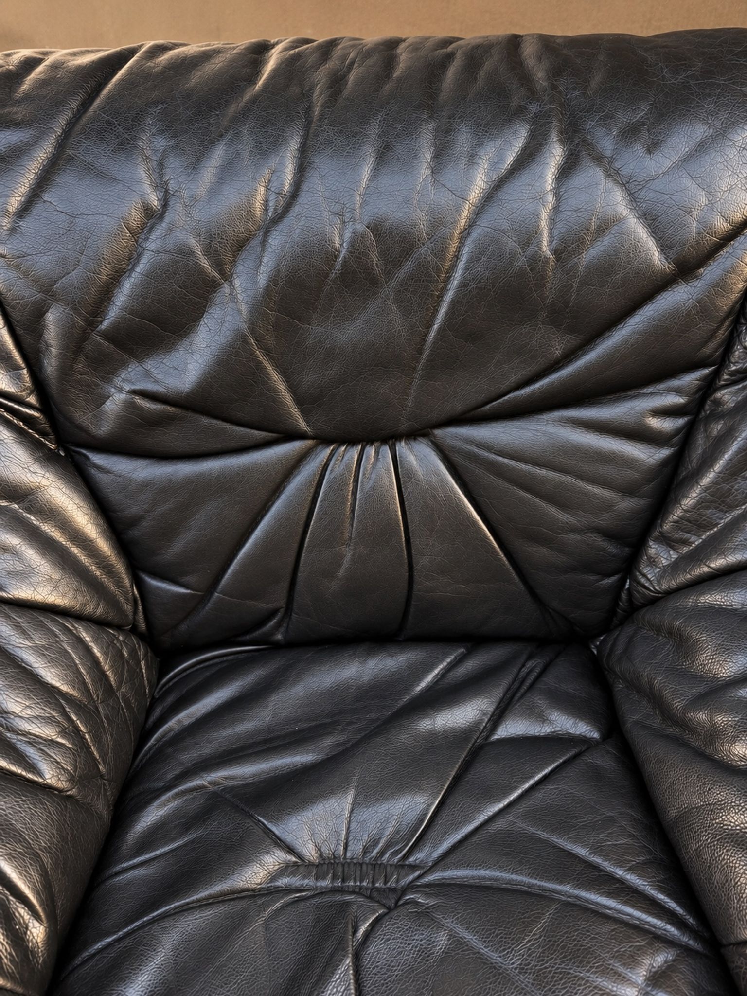Leather armchairs and matching pouf, Italy, circa 1980