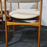 A set of four vintage teak dining chairs