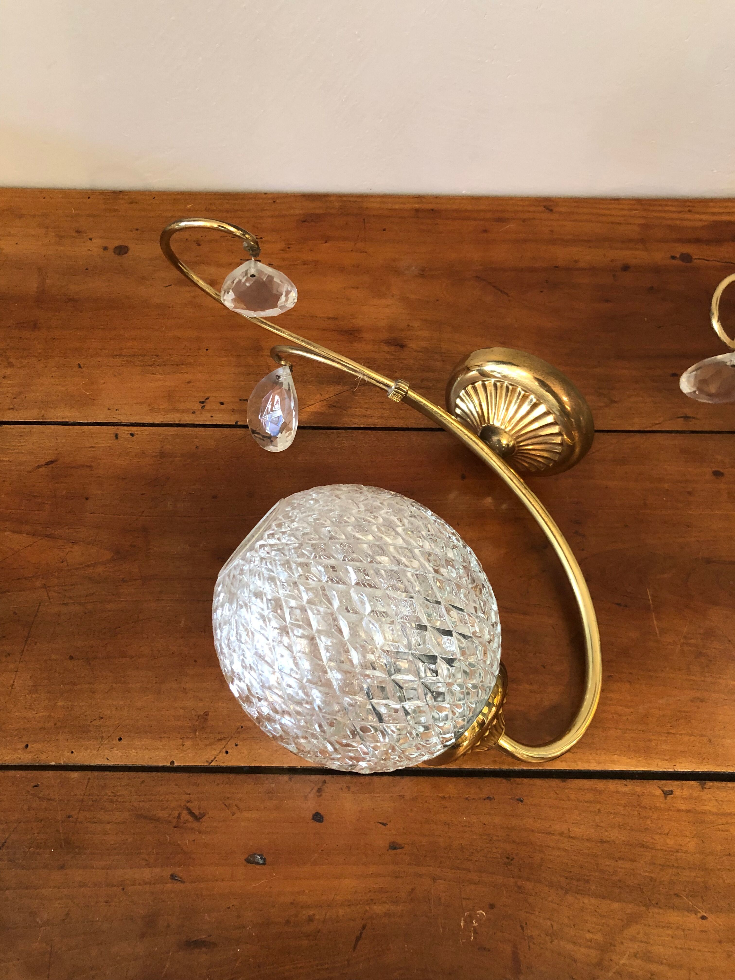 Duo of brass and glass wall lamps