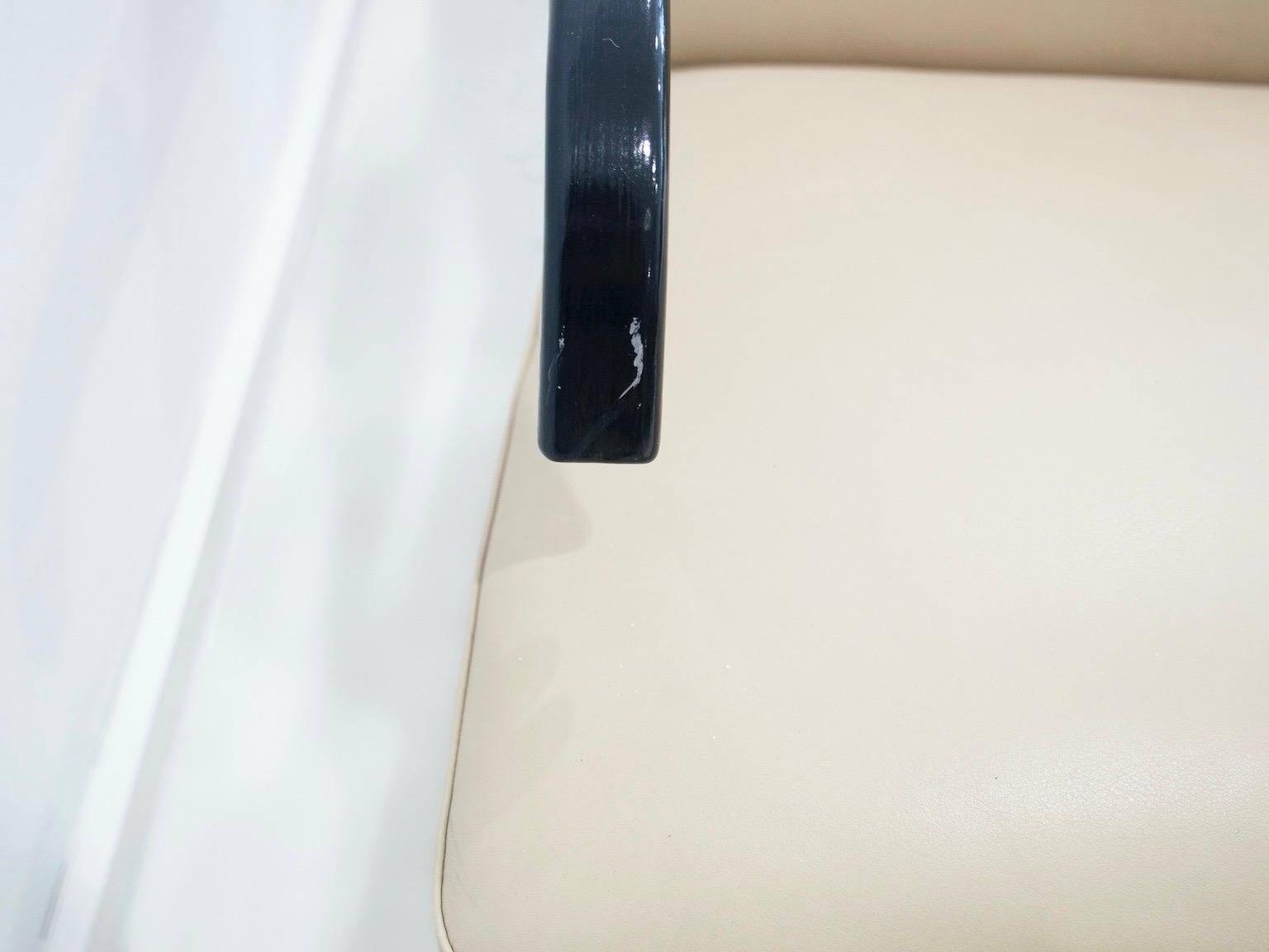 Pair of beige leather and tubular steel armchairs.