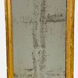 Louis XVI mirror in carved and gilded wood with leaf 18th century