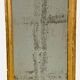 Louis XVI mirror in carved and gilded wood with leaf 18th century