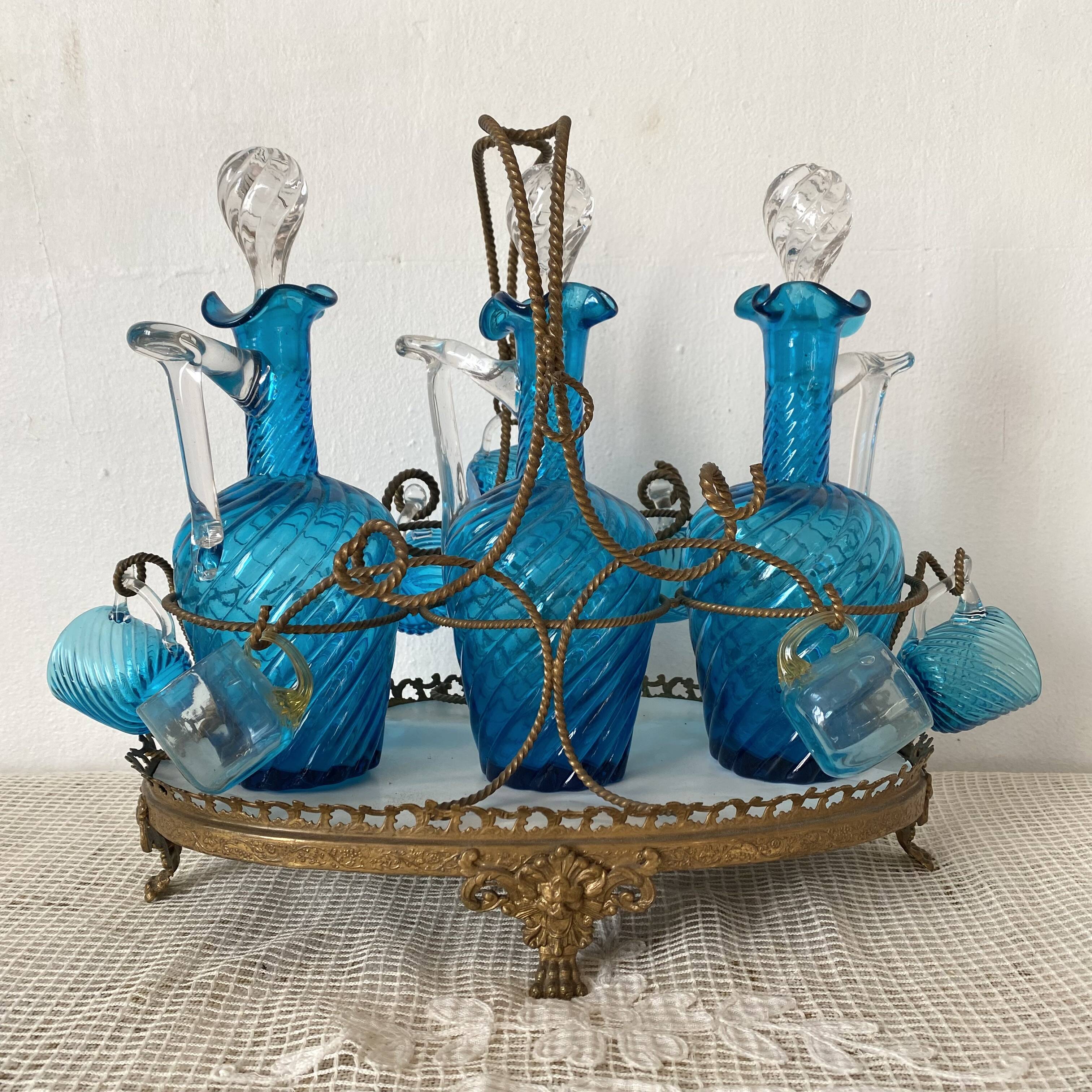 Antique Legras liquor cabinet, decanters and glasses, lion's paw stand