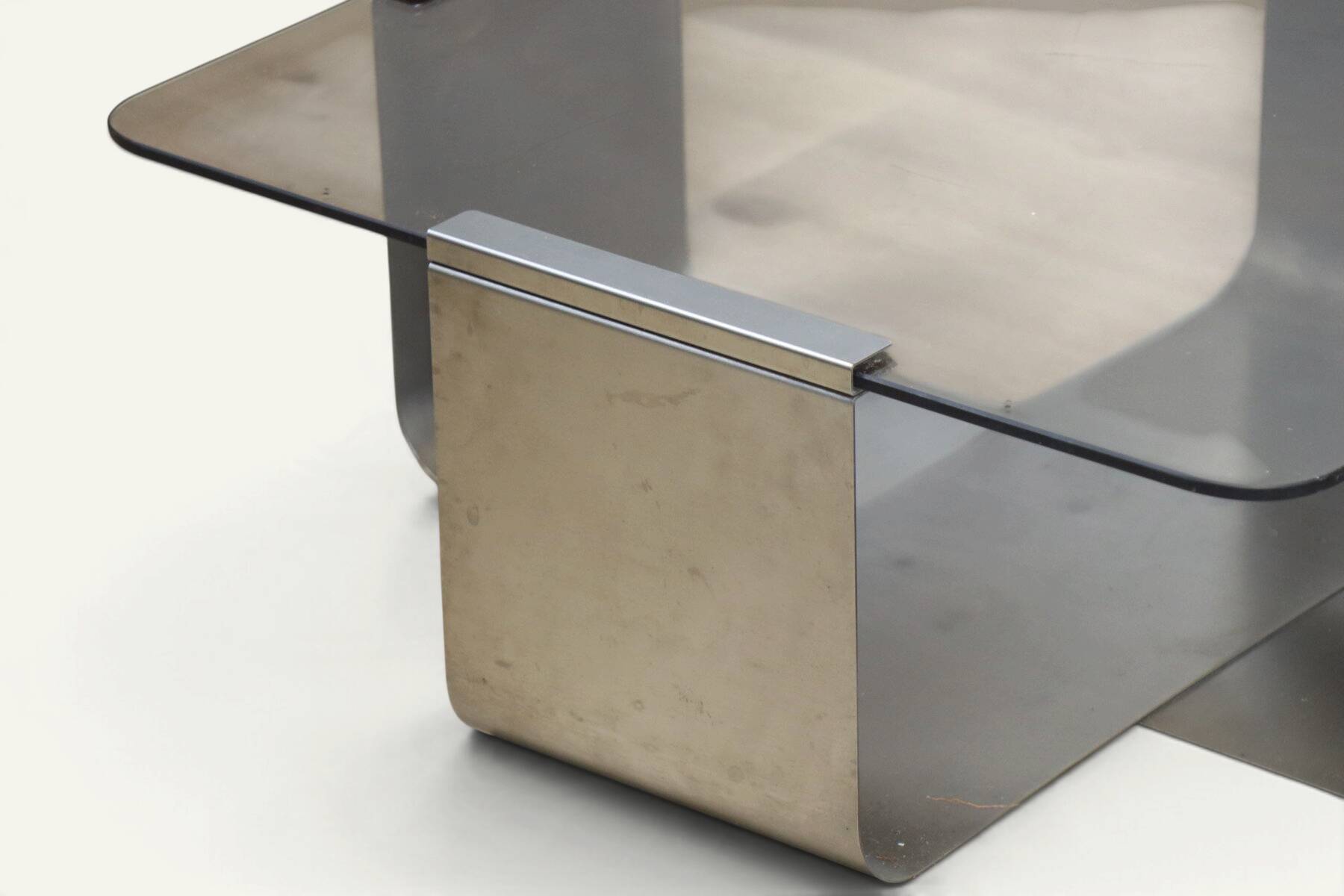 Brushed steel and smoked glass coffee table, by François Monnet – 1970s