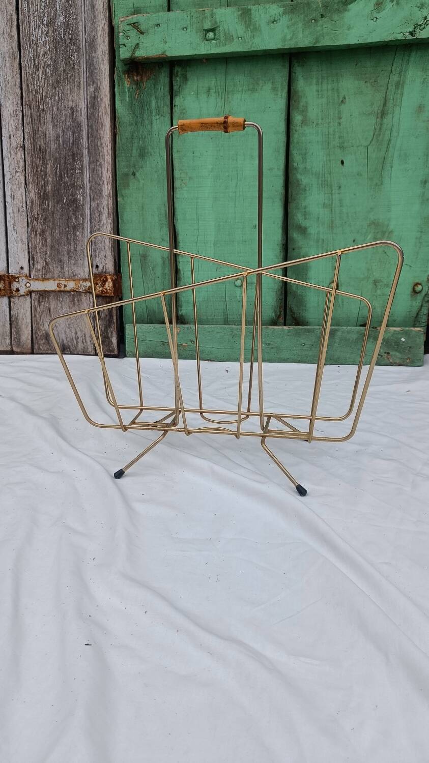 Vintage magazine rack in golden brass