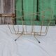 Vintage magazine rack in golden brass