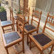 Set of 6 antique turned wooden chairs with embossed leather seats.