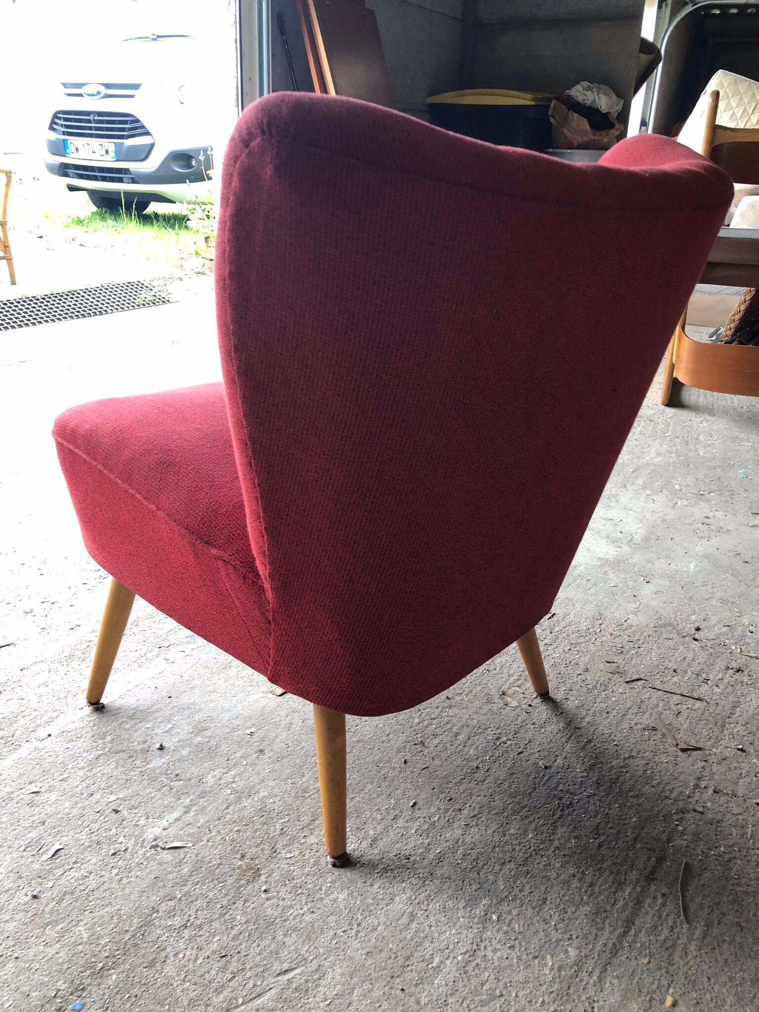 Vintage red cocktail armchair with compass feet