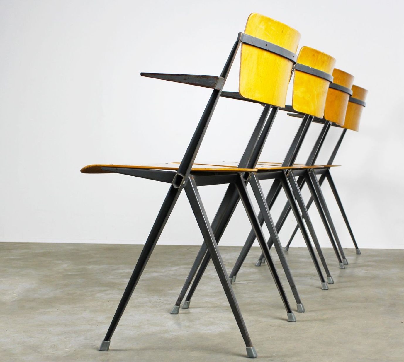 Vintage Pyramid chairs with armrests by Wim Rietveld