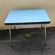 Vintage set from the 60s/70s: table, chairs, and marbled Formica stools.