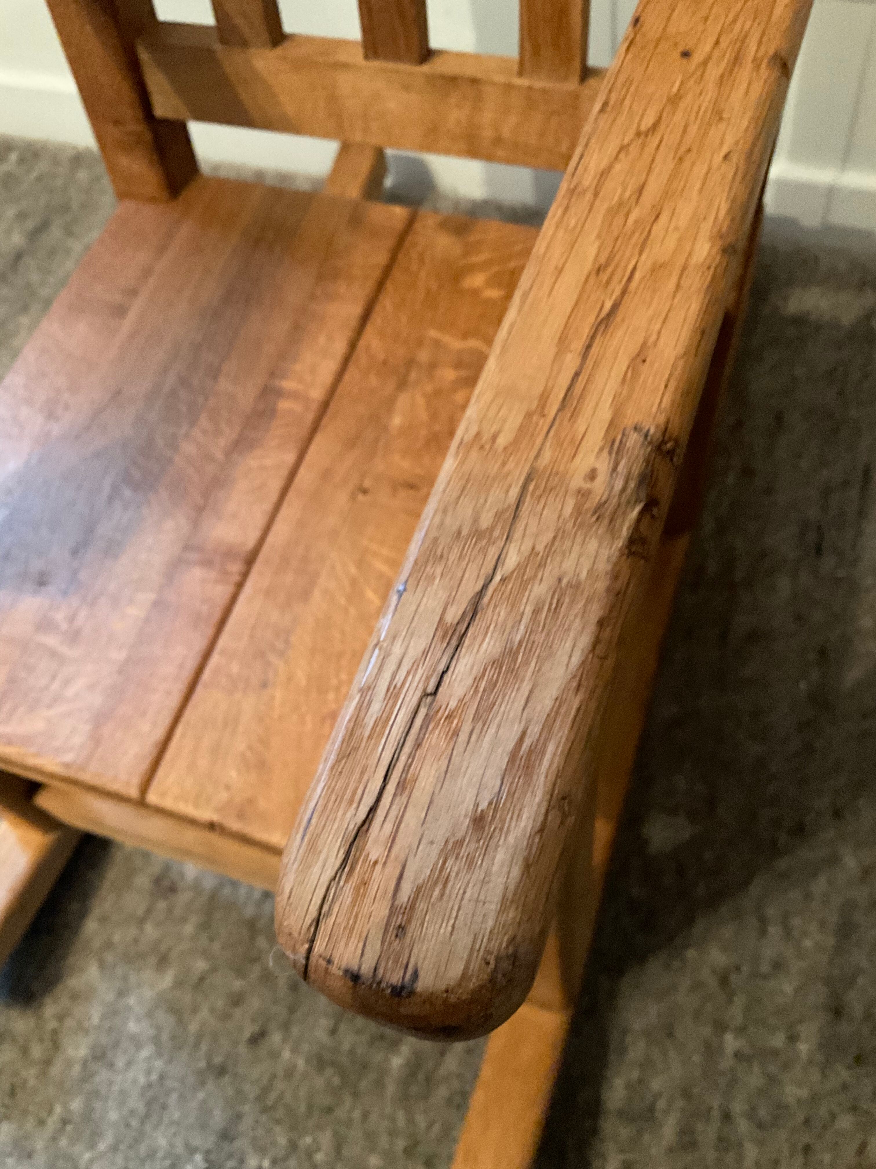 Old children's rocking chair in solid wood