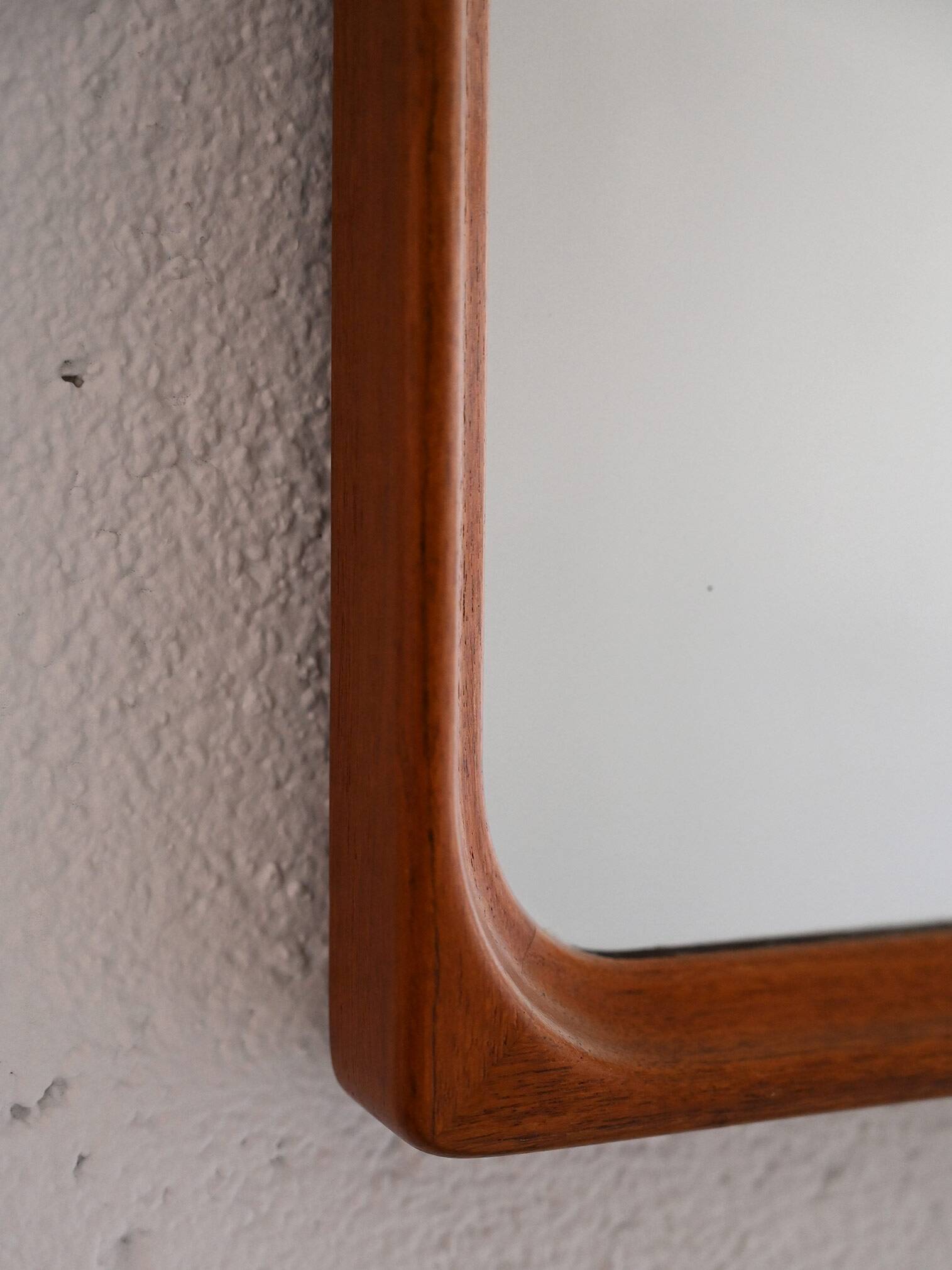 Vintage half-bust mirror with wooden frame
