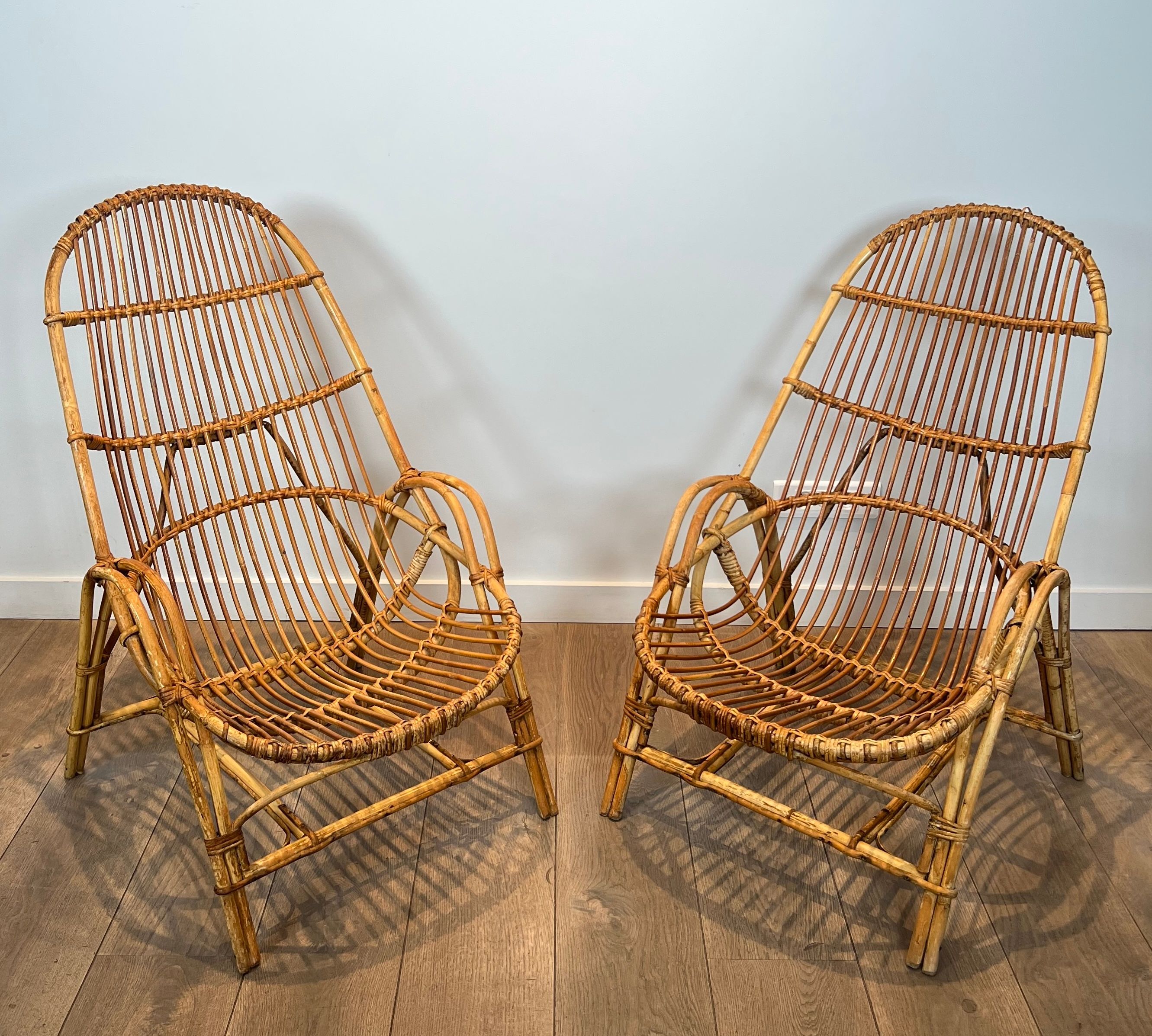 Pair of designer armchairs in rattan