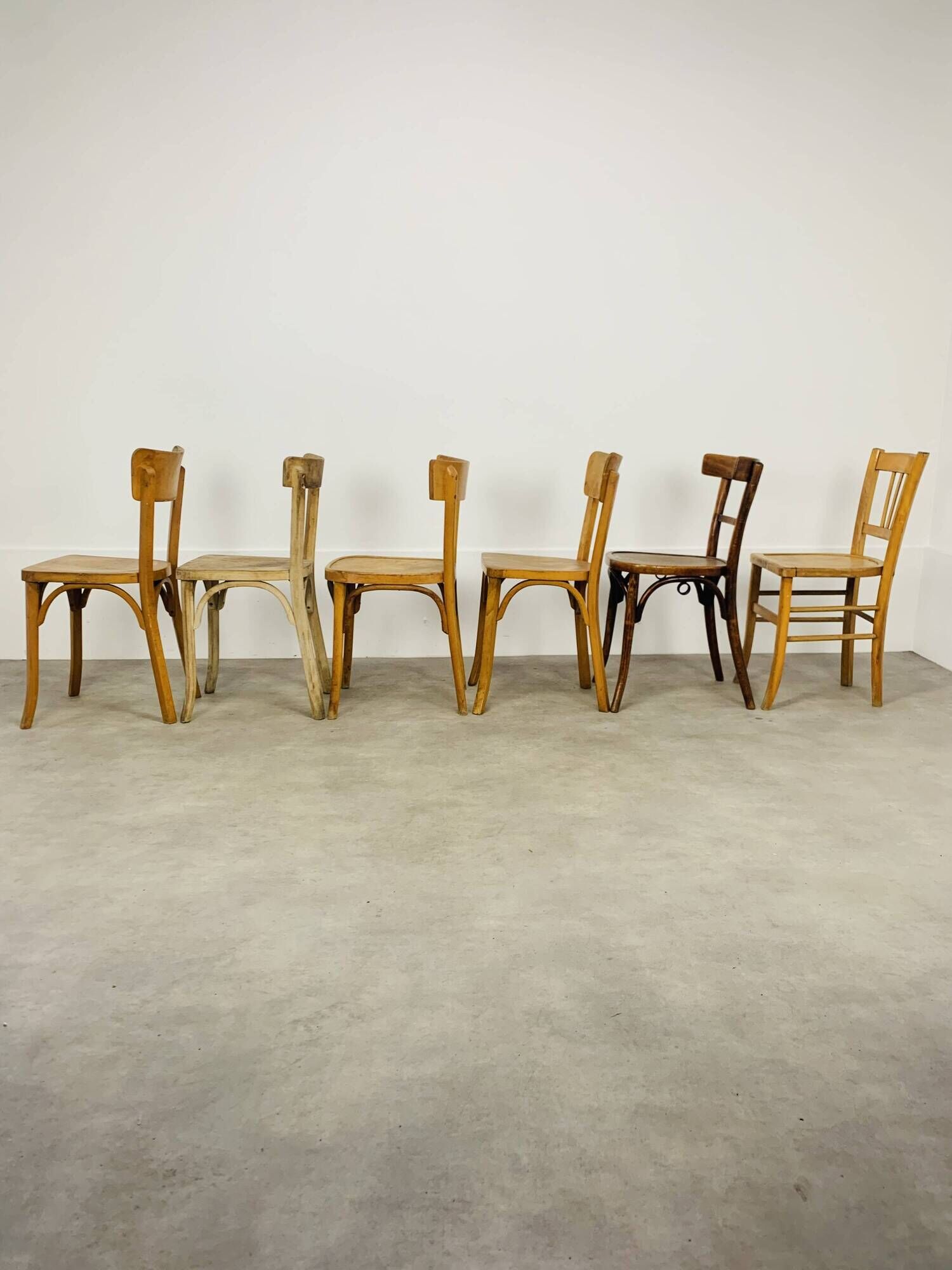 6 mismatched Baumann & Luterma bistro chairs, wood, 1960s