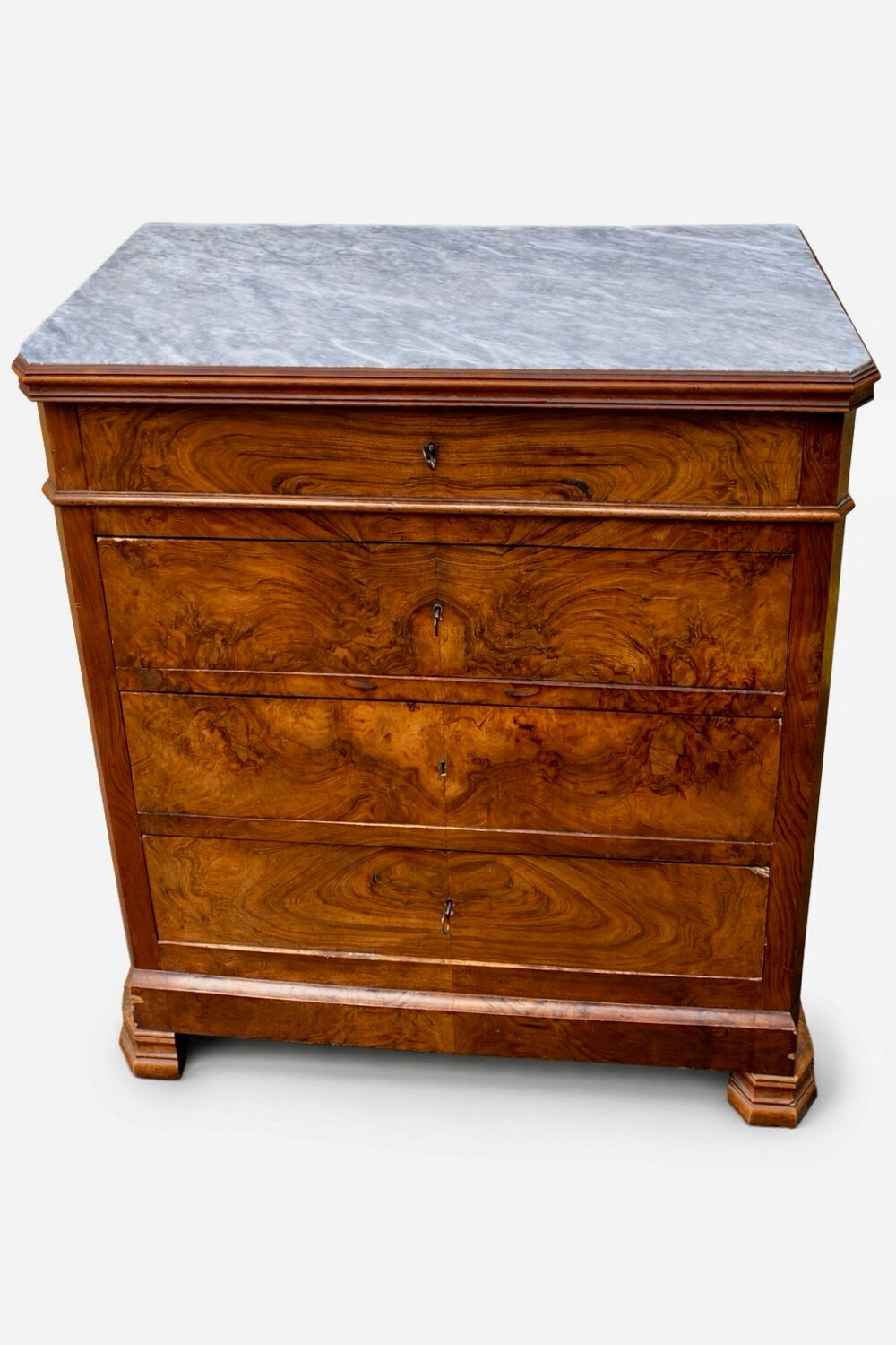 Antique Louis Philippe style chest of drawers with a white marble top.