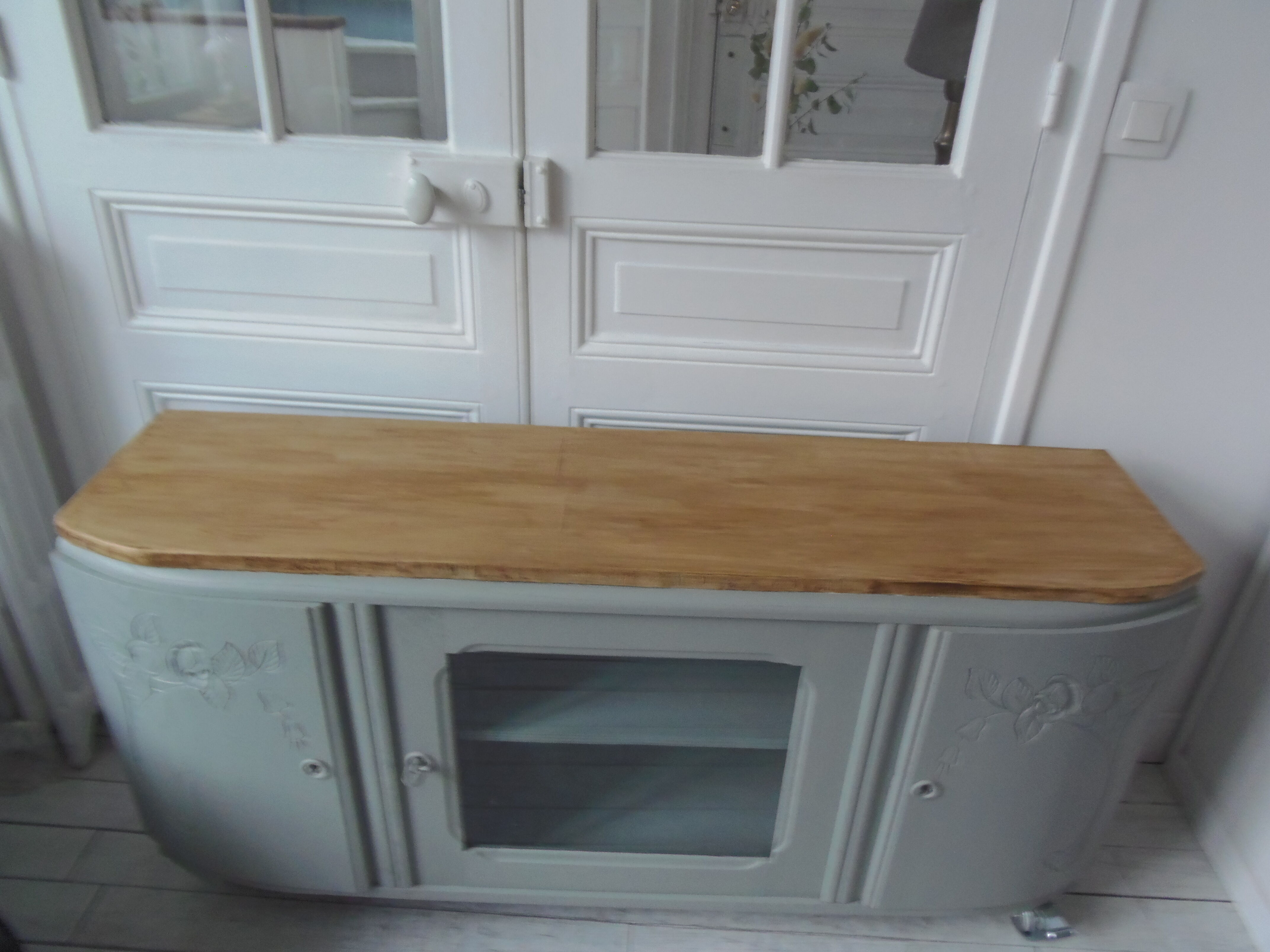Art Deco furniture revisited in gray green and placed on wheels.