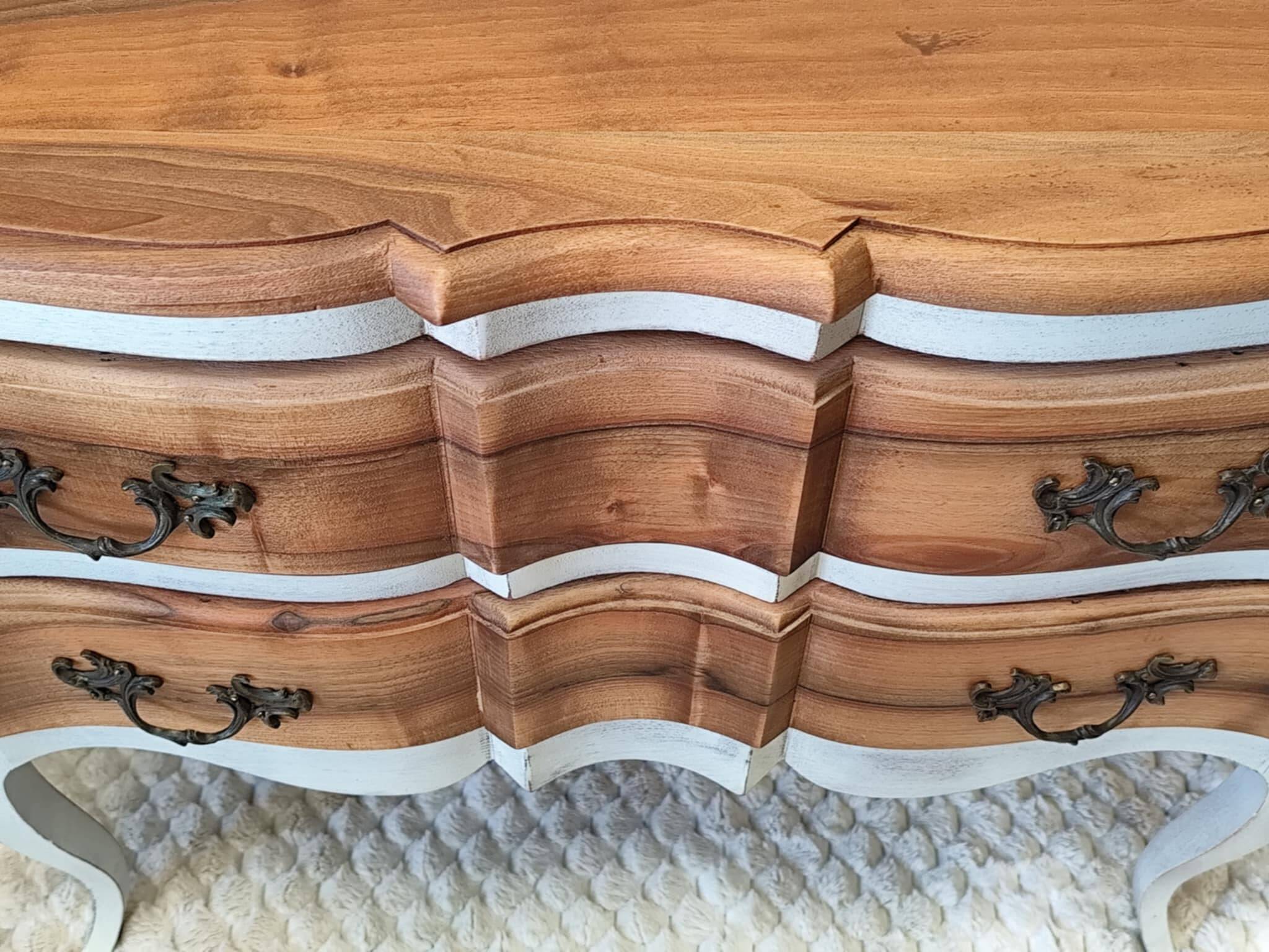 Walnut crossbow chest of drawers